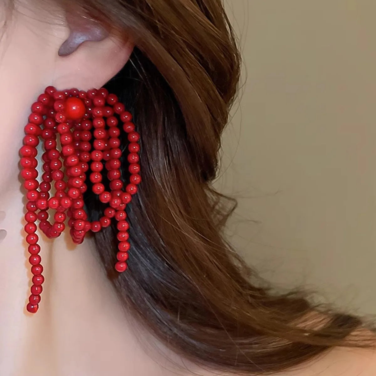ARETES MOÑO ROJO