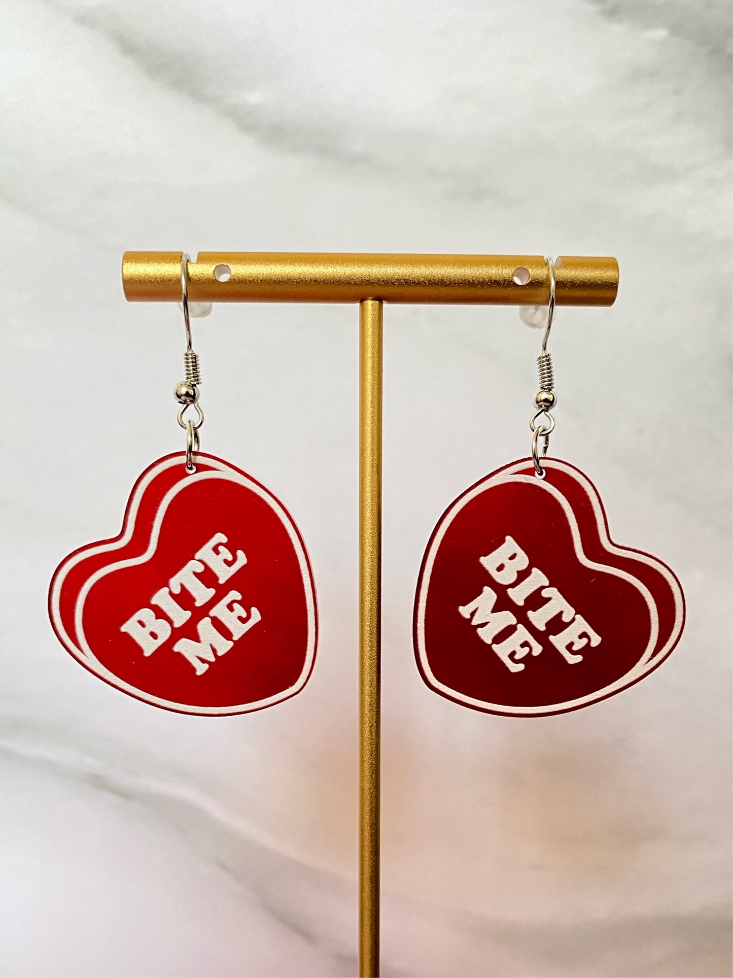 ARETES BITE ME ROJO