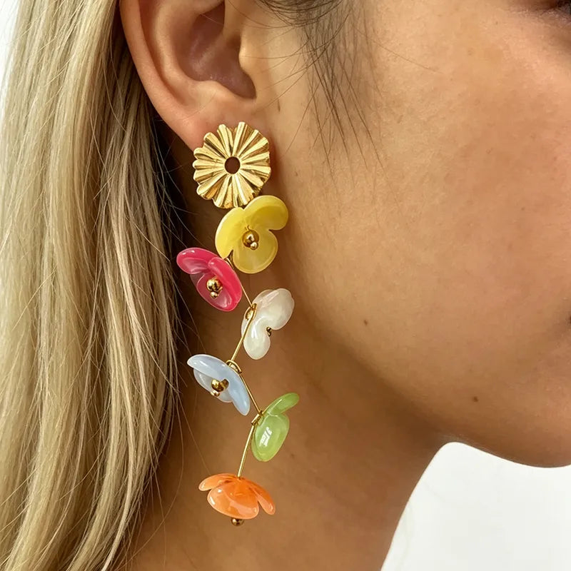 ARETES LARGOS FLORES AC INOX
