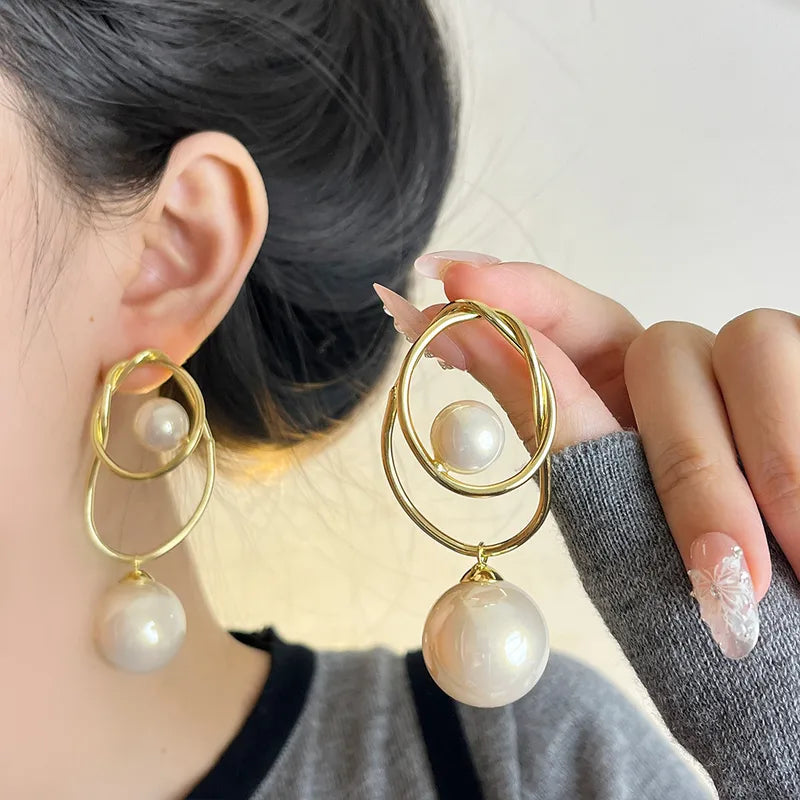 ARETES BRISA IRREGULARES CON PERLA